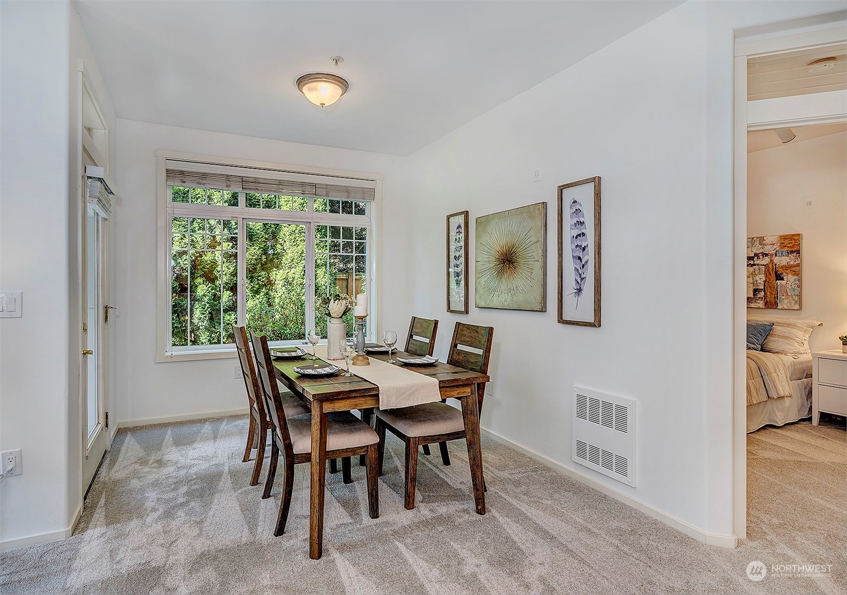 555 Anacortes Court Northeast, Unit 101 Renton, WA 98059 - Photo 10 of 22 a view of a dining room with furniture window and outside view