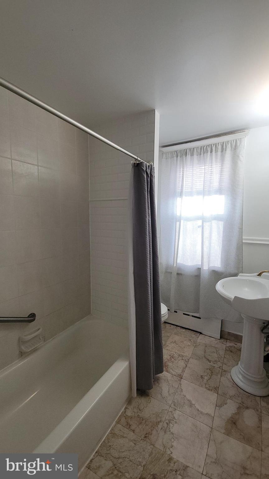 1806 Garrett Road Lansdowne, PA 19050 - Photo 18 of 25 a bathroom with a sink toilet and shower
