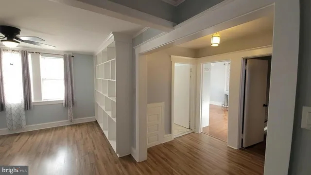 a view of hallway with wooden floor