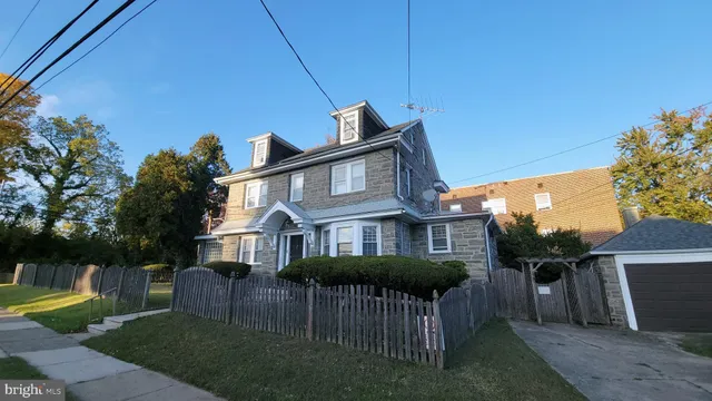 a view of a house with a yard porch and sitting area