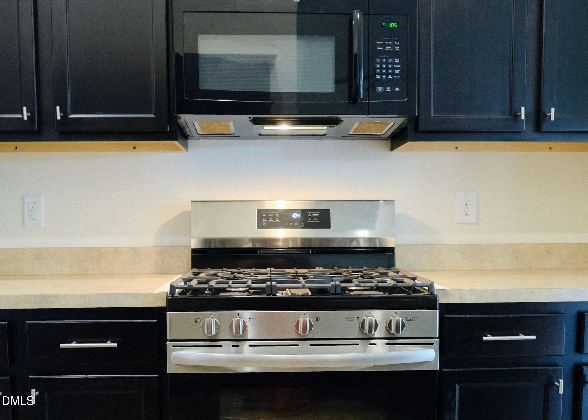 15 Cedar Falls Way Angier, NC 27501 - Photo 11 of 56 a kitchen with stove and cabinets