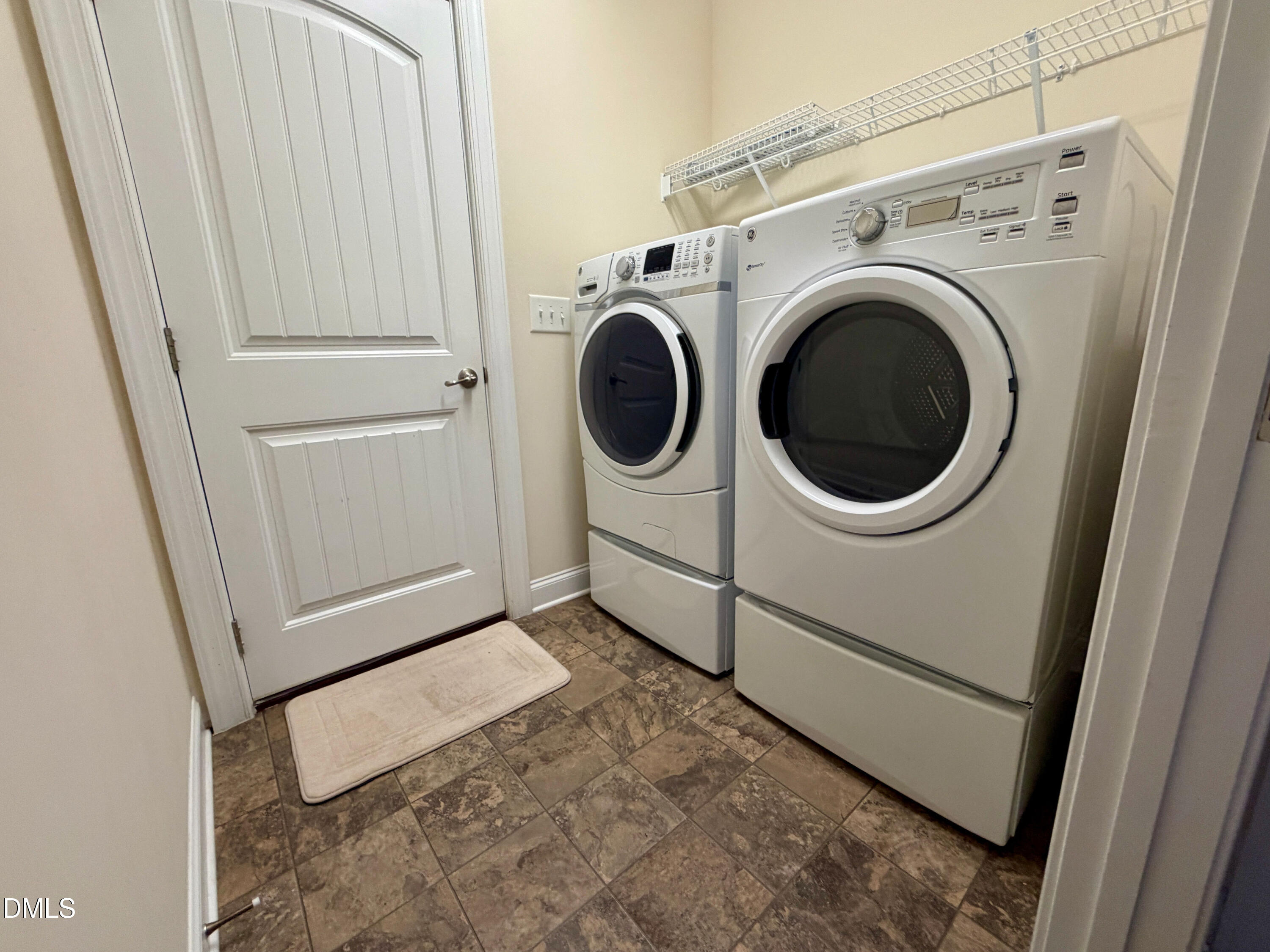 15 Cedar Falls Way Angier, NC 27501 - Photo 16 of 56 a utility room with dryer and washer