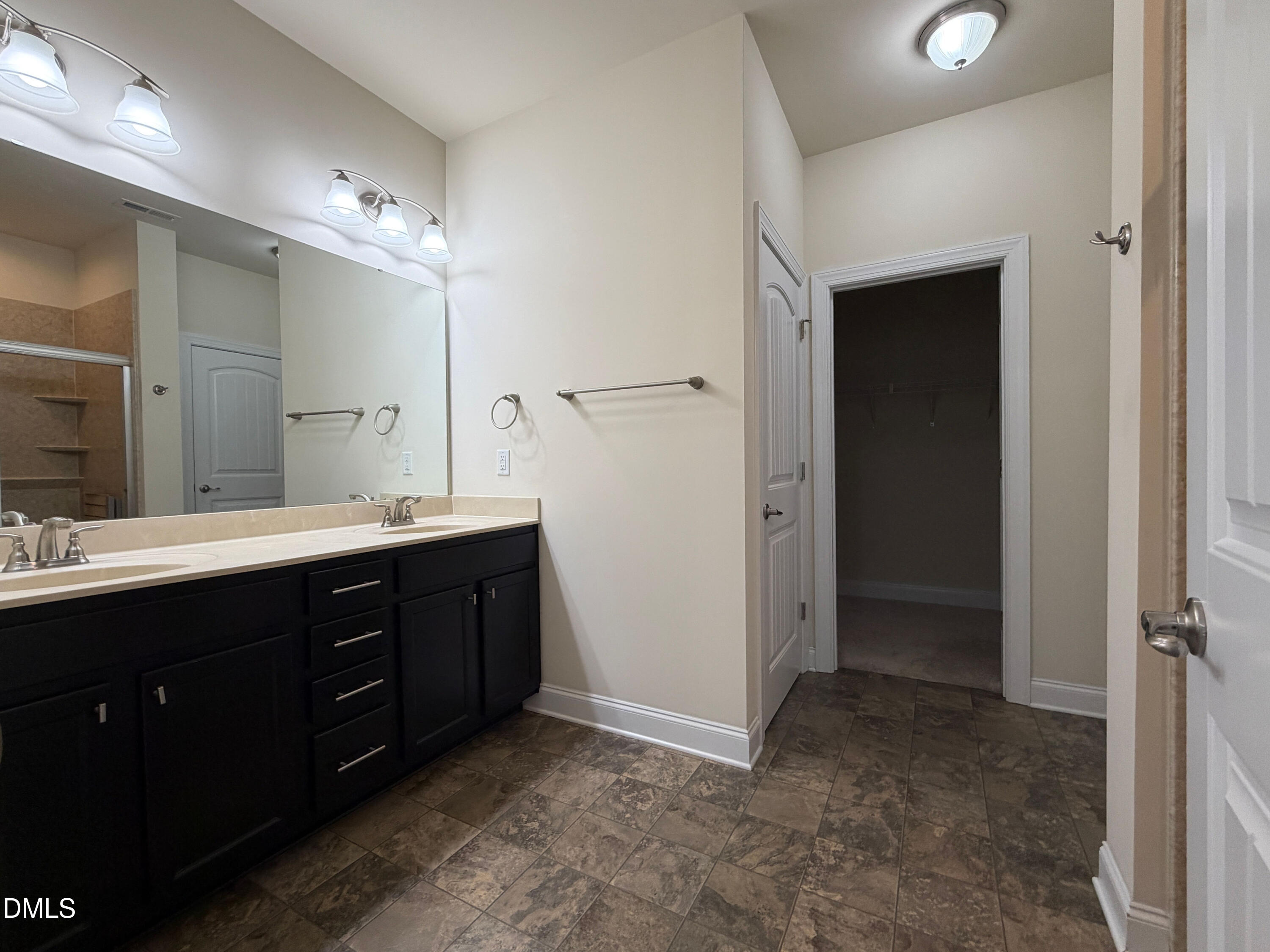 15 Cedar Falls Way Angier, NC 27501 - Photo 22 of 56 a bathroom with a double vanity sink and mirror