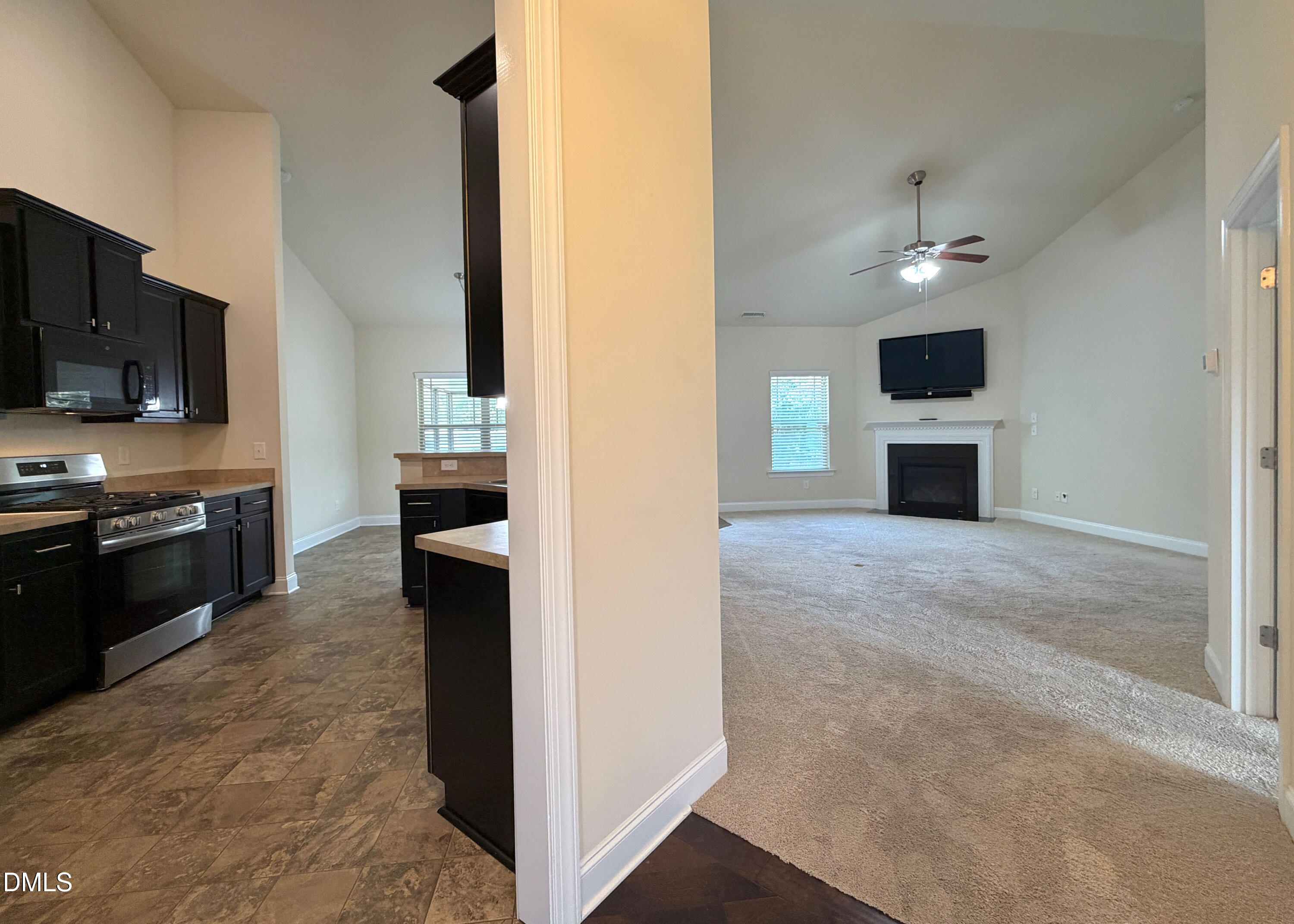 15 Cedar Falls Way Angier, NC 27501 - Photo 4 of 56 a view of a kitchen with an oven and cabinets