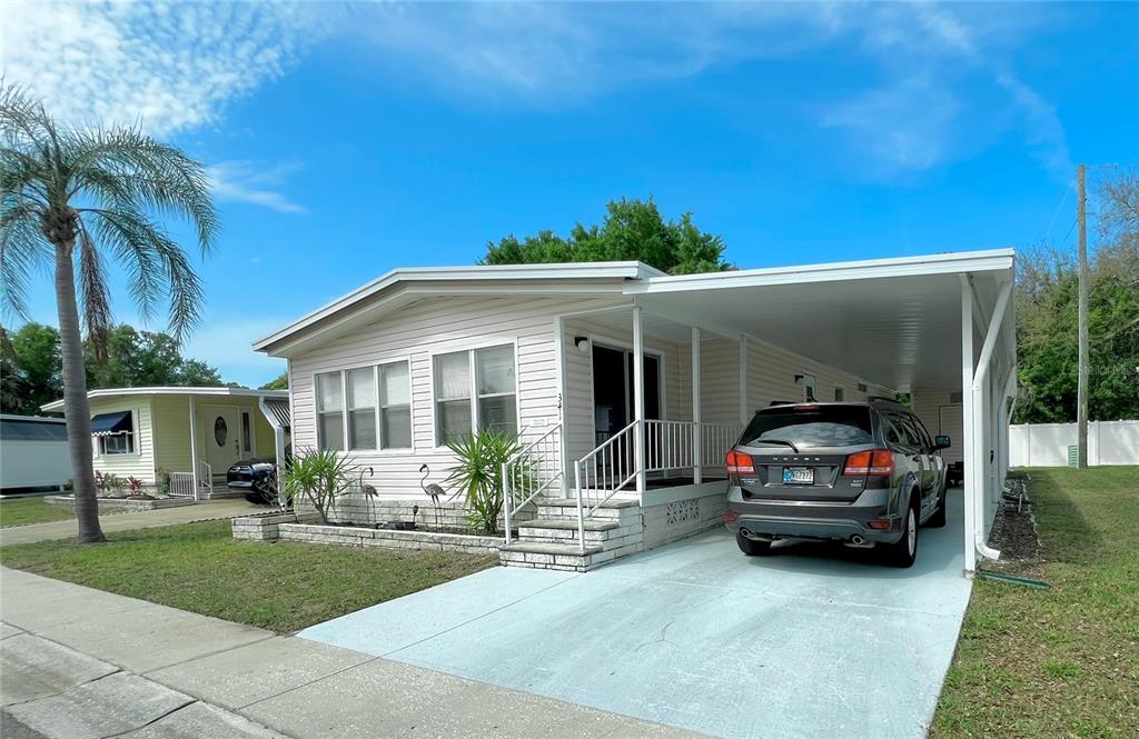 1100 South Belcher Road, Unit 341 Largo, FL 33771 - Photo 1 of 1 front of home with long driveway for 2 or 3 vehicles
