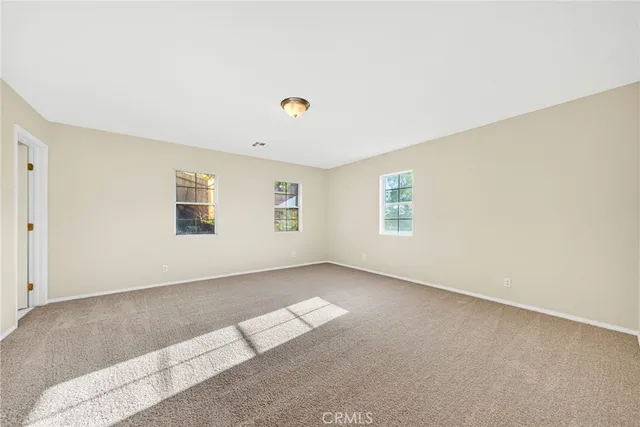 a view of an entryway with a hallway