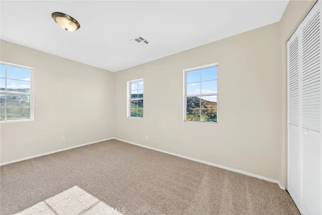 an empty room with windows