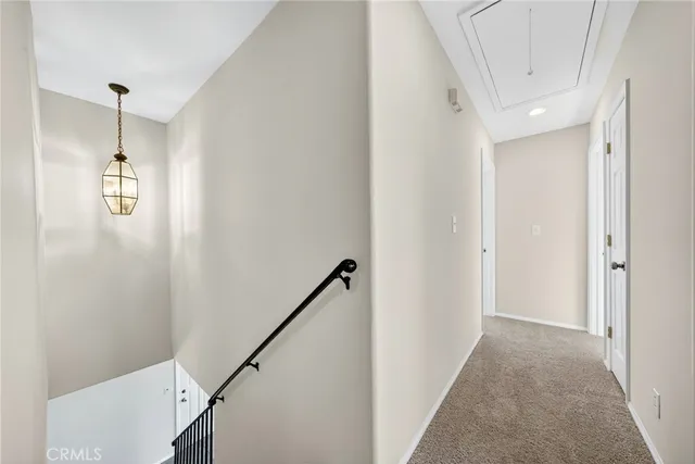 an empty room with a empty space and windows