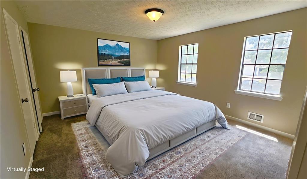 337 Independence Drive Jonesboro, GA 30238 - Photo 11 of 41 a bedroom with a bed and a window