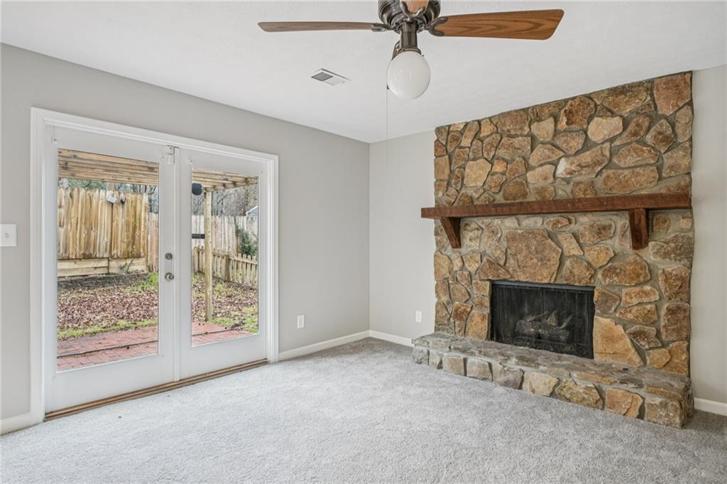 337 Independence Drive Jonesboro, GA 30238 - Photo 12 of 41 a living room with furniture and a fireplace