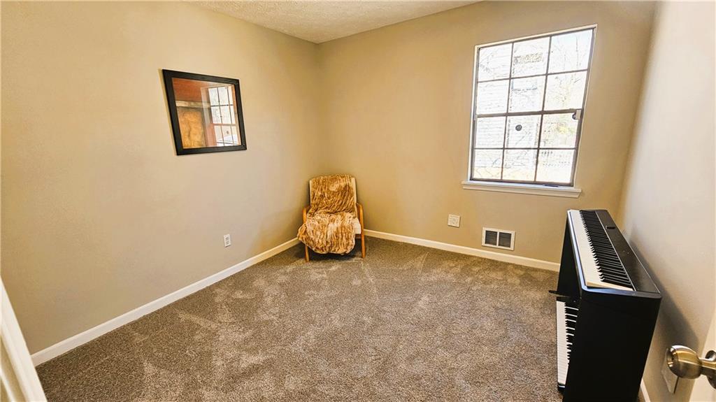 337 Independence Drive Jonesboro, GA 30238 - Photo 16 of 41 a view of room with window and wooden floor