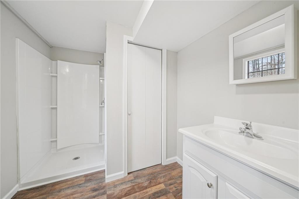 337 Independence Drive Jonesboro, GA 30238 - Photo 18 of 41 a bathroom with a sink and a mirror