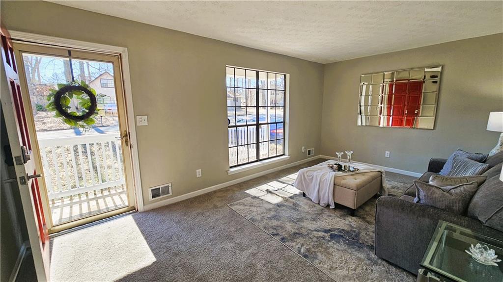 337 Independence Drive Jonesboro, GA 30238 - Photo 21 of 41 a living room with furniture and a window