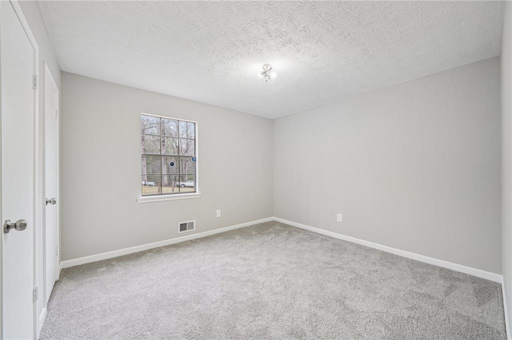 337 Independence Drive Jonesboro, GA 30238 - Photo 22 of 41 an empty room with windows