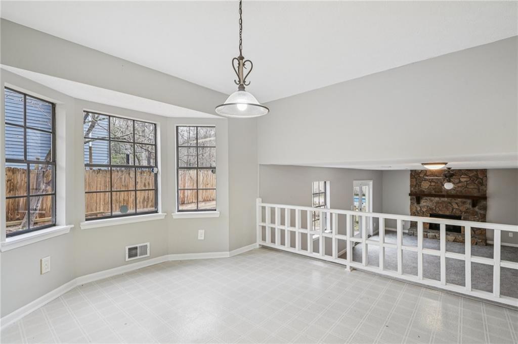 337 Independence Drive Jonesboro, GA 30238 - Photo 24 of 41 a view of an empty room with a window and fireplace
