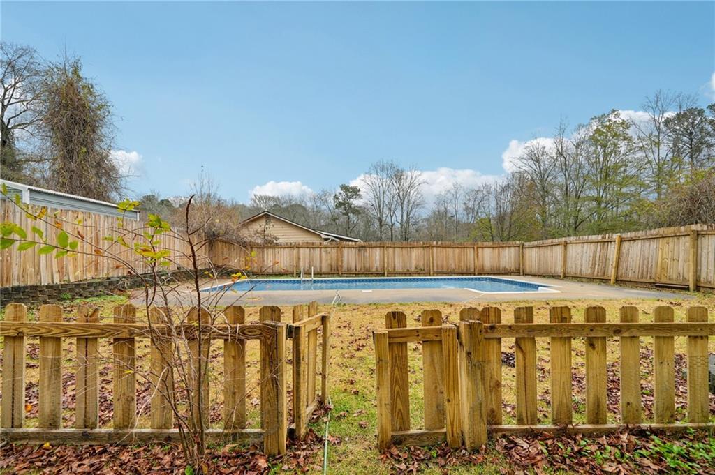 337 Independence Drive Jonesboro, GA 30238 - Photo 38 of 41 a view of a pathway with a wrought fence