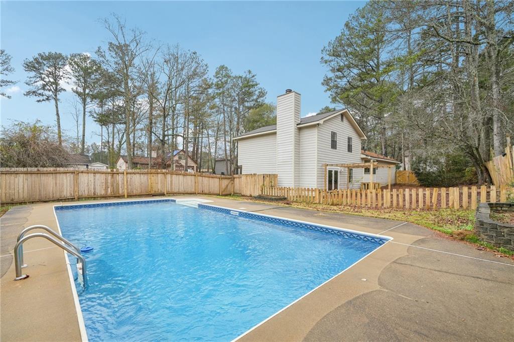 337 Independence Drive Jonesboro, GA 30238 - Photo 40 of 41 a view of a house with a swimming pool