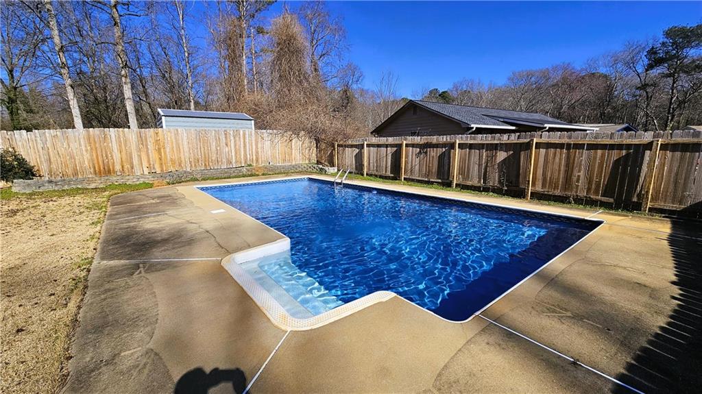 337 Independence Drive Jonesboro, GA 30238 - Photo 4 of 41 a view of a house with wooden fence
