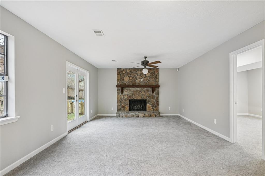337 Independence Drive Jonesboro, GA 30238 - Photo 7 of 41 a view of an empty room with a fireplace