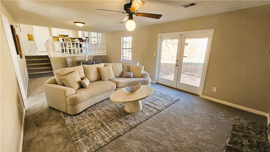 337 Independence Drive Jonesboro, GA 30238 - Photo 8 of 41 a living room with furniture and a flat screen tv