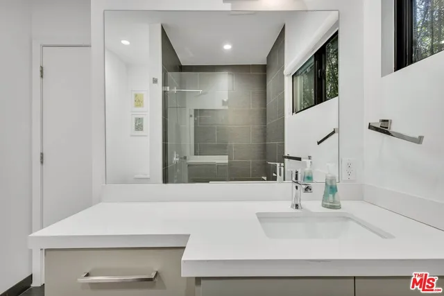 a bathroom with a sink and a mirror