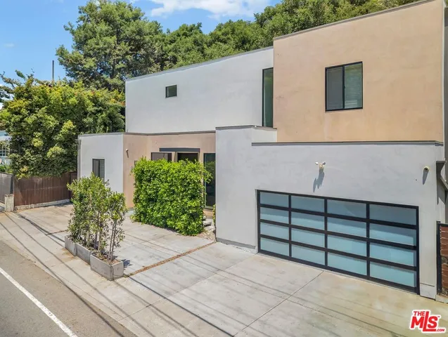 a view of a house with a garage