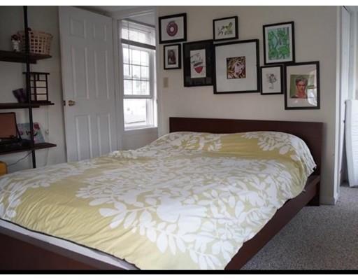 20 Milton Street Saugus, MA 01906 - Photo 13 of 30 a bed sitting in a bedroom next to a window