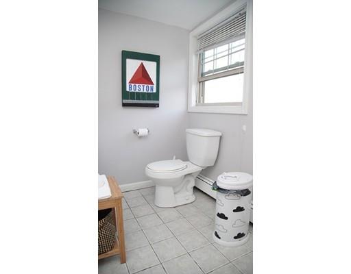 20 Milton Street Saugus, MA 01906 - Photo 17 of 30 a bathroom with a toilet a sink and a window
