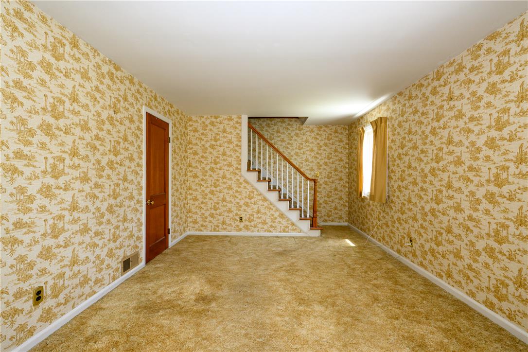 2270 Rodgers Street Bethlehem, PA 18017 - Photo 2 of 24 This inviting room features warm carpet and a classic staircase, ready for your personal touch.
