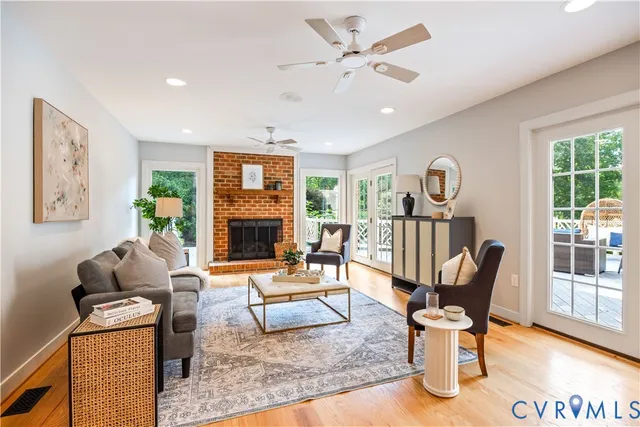 a bathroom with a granite countertop sink a toilet a mirror and shower