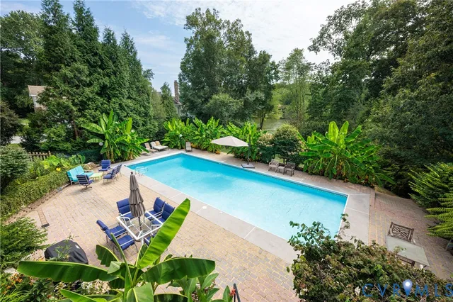 a kitchen with stainless steel appliances granite countertop a sink a stove and cabinets