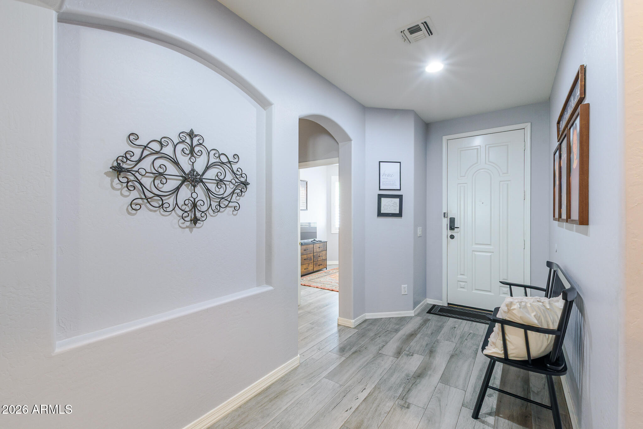 4521 West Moss Springs Road Anthem, AZ 85086 - Photo 9 of 35 a view of empty room with wooden floor and fan