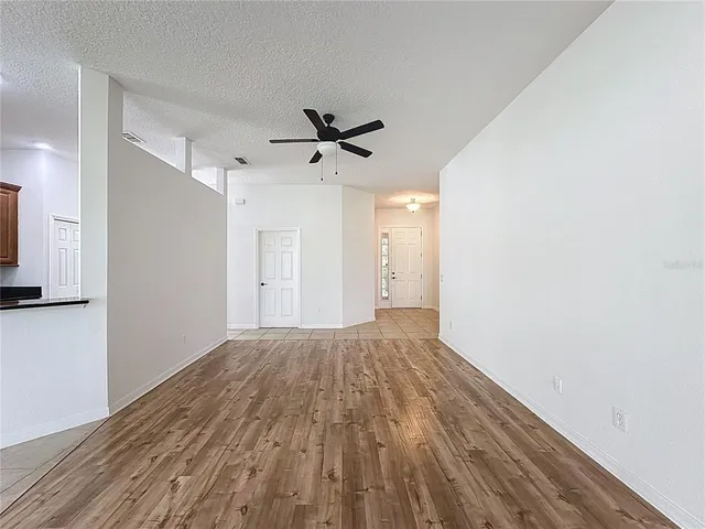 a bathroom with a sink a bathtub and next to a window