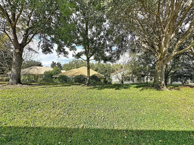 a view of a golf course with a lake