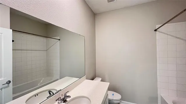 a bathroom with a sink and mirror