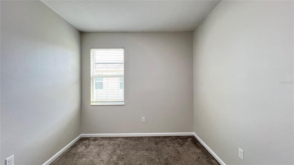 16466 Glassy Loch Loop Clermont, FL 34714 - Photo 16 of 37 an empty room with a window