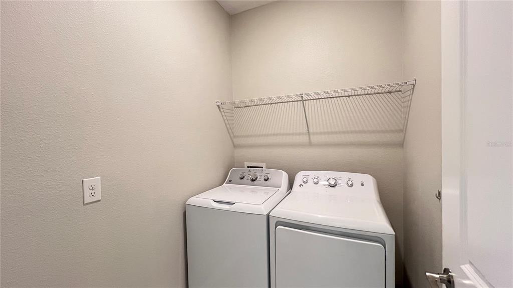 16466 Glassy Loch Loop Clermont, FL 34714 - Photo 19 of 37 a utility room with dryer and washer