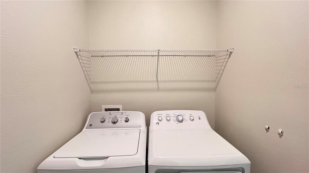 16466 Glassy Loch Loop Clermont, FL 34714 - Photo 20 of 37 a utility room with dryer and washer