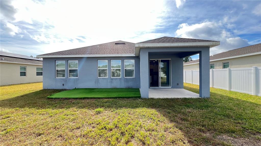 16466 Glassy Loch Loop Clermont, FL 34714 - Photo 29 of 37 a view of a yard in front of a house with a large tree
