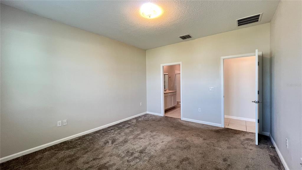 16466 Glassy Loch Loop Clermont, FL 34714 - Photo 30 of 37 an empty room with closet area