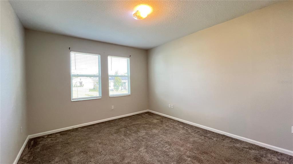 16466 Glassy Loch Loop Clermont, FL 34714 - Photo 31 of 37 an empty room with a window