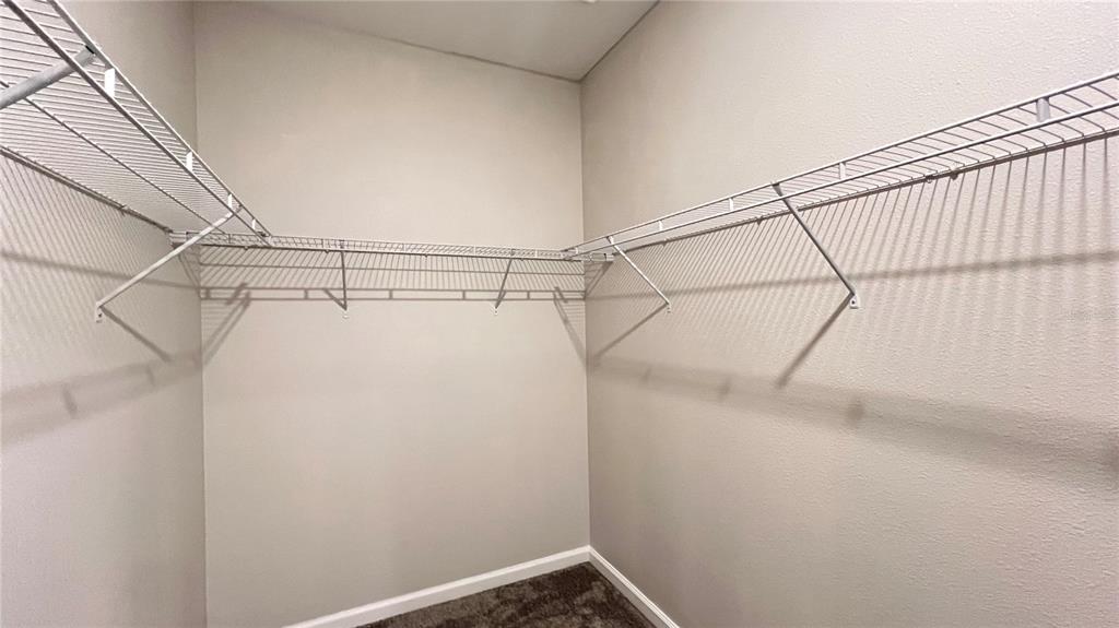 16466 Glassy Loch Loop Clermont, FL 34714 - Photo 37 of 37 a view of a room with racks on the wall