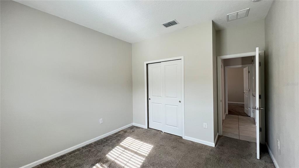 16466 Glassy Loch Loop Clermont, FL 34714 - Photo 6 of 37 a view of an empty room and window