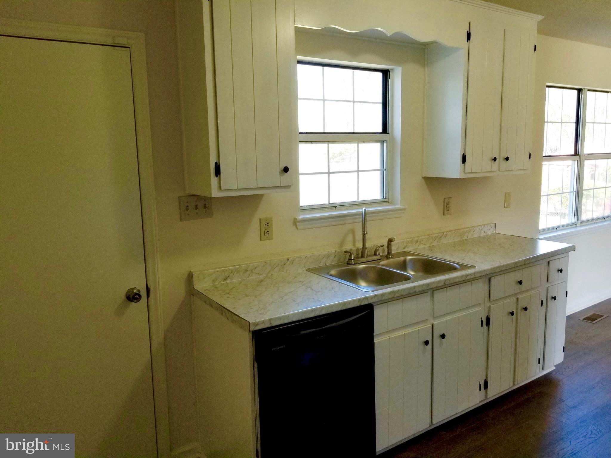 135 Truman Road Inwood, WV 25428 - Photo 11 of 30 a kitchen with a sink cabinets and window
