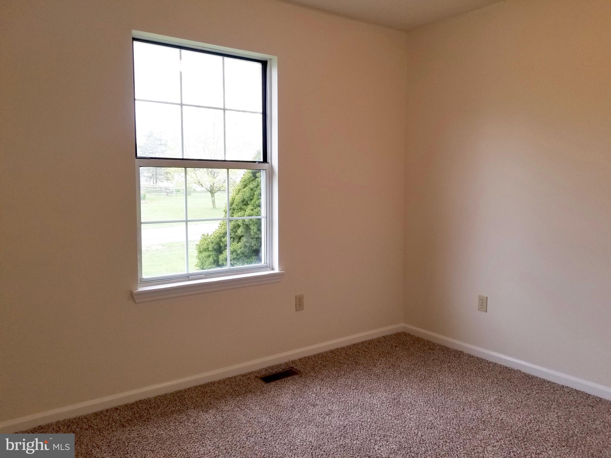 135 Truman Road Inwood, WV 25428 - Photo 14 of 30 an empty room with a window