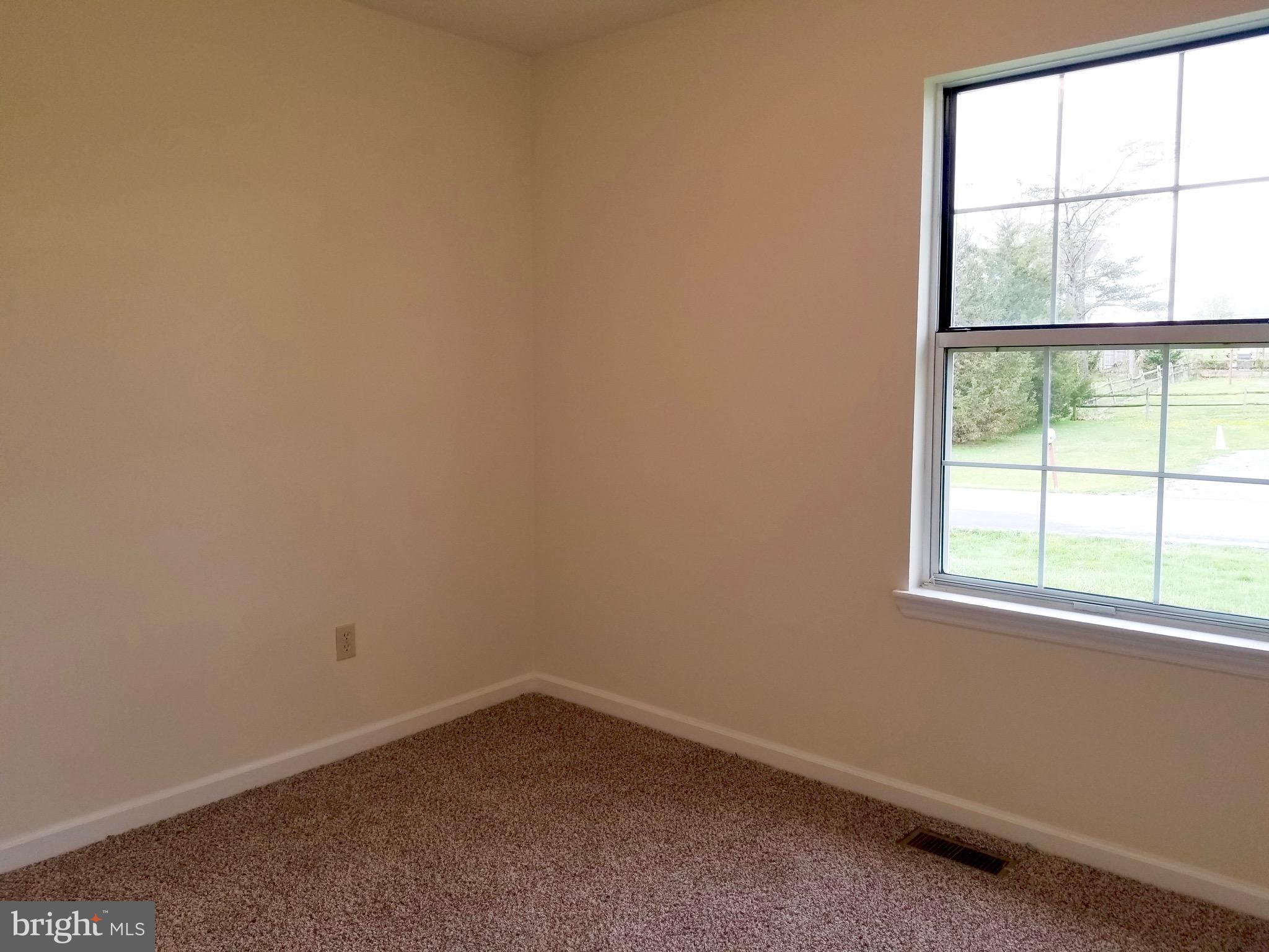 135 Truman Road Inwood, WV 25428 - Photo 16 of 30 an empty room with a window