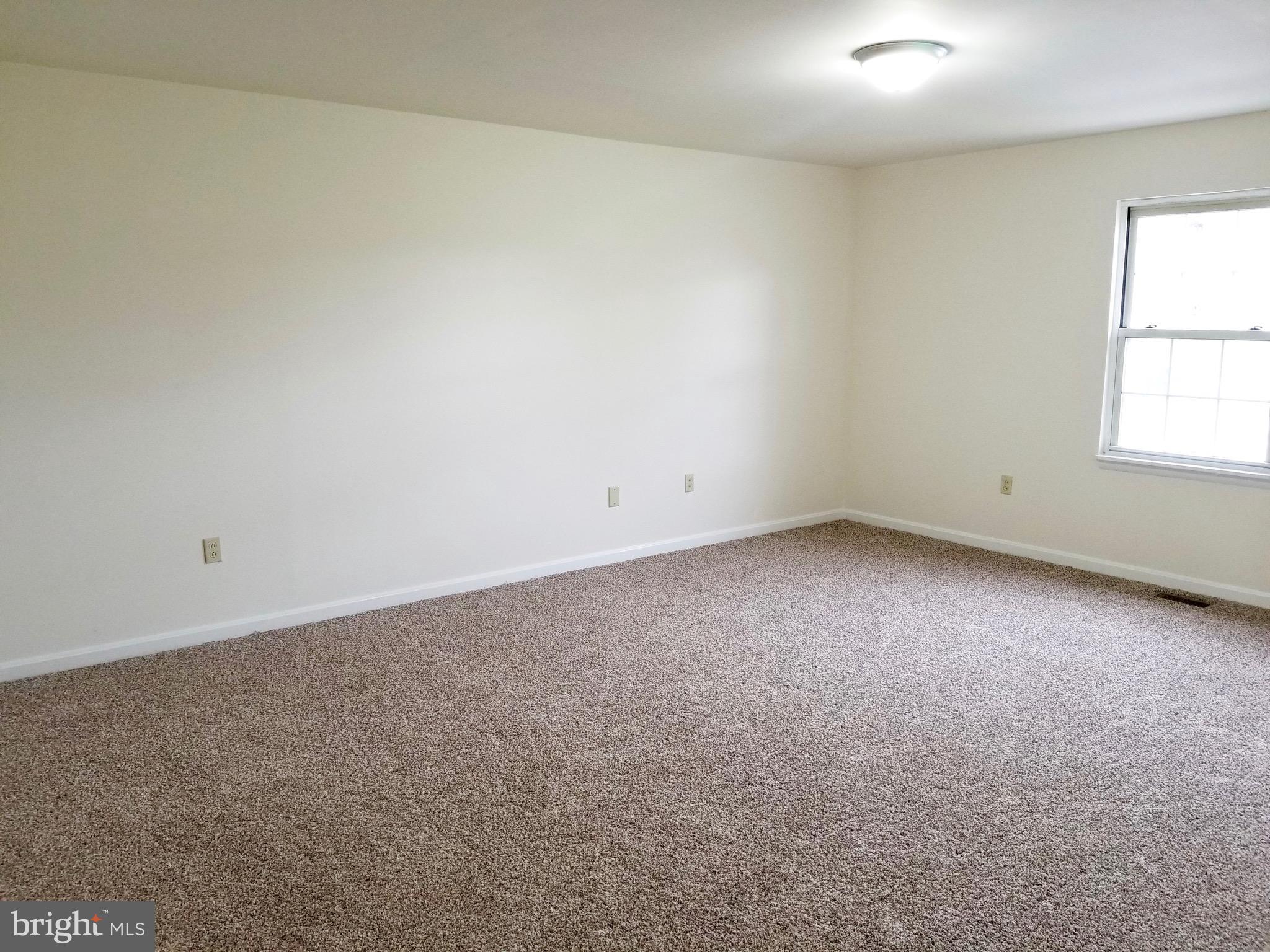 135 Truman Road Inwood, WV 25428 - Photo 19 of 30 an empty room with a window