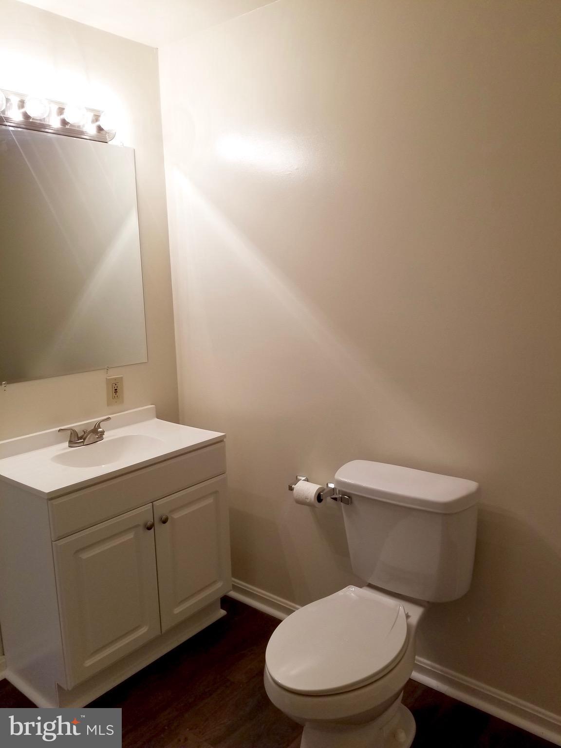 135 Truman Road Inwood, WV 25428 - Photo 23 of 30 a white toilet sitting next to a bathroom sink
