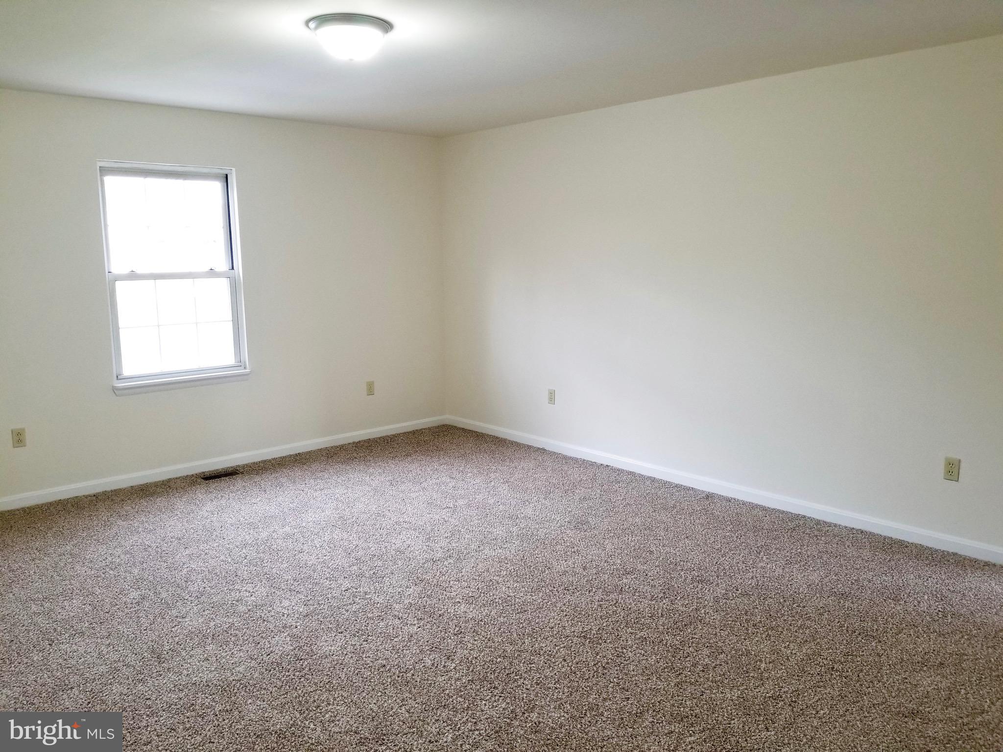 135 Truman Road Inwood, WV 25428 - Photo 24 of 30 an empty room with a window
