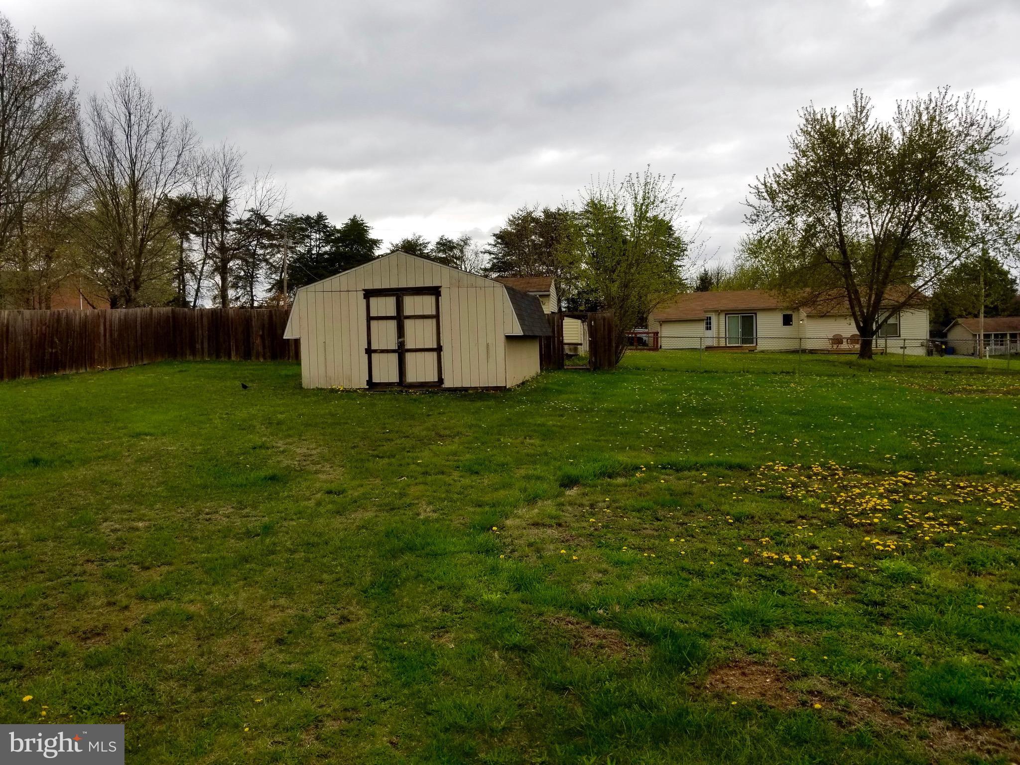 135 Truman Road Inwood, WV 25428 - Photo 29 of 30 a view of a tiny house with a yard